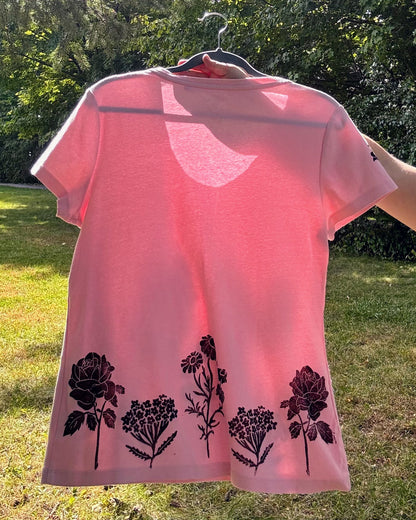 Free & Wild; pink short sleeve t-shirt featuring roses and wildflowers