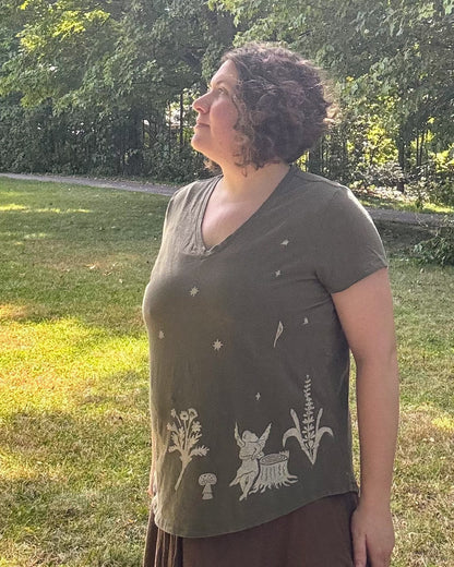 Fairy Garden Party; olive green short sleeve t-shirt featuring fairies and wildflowers