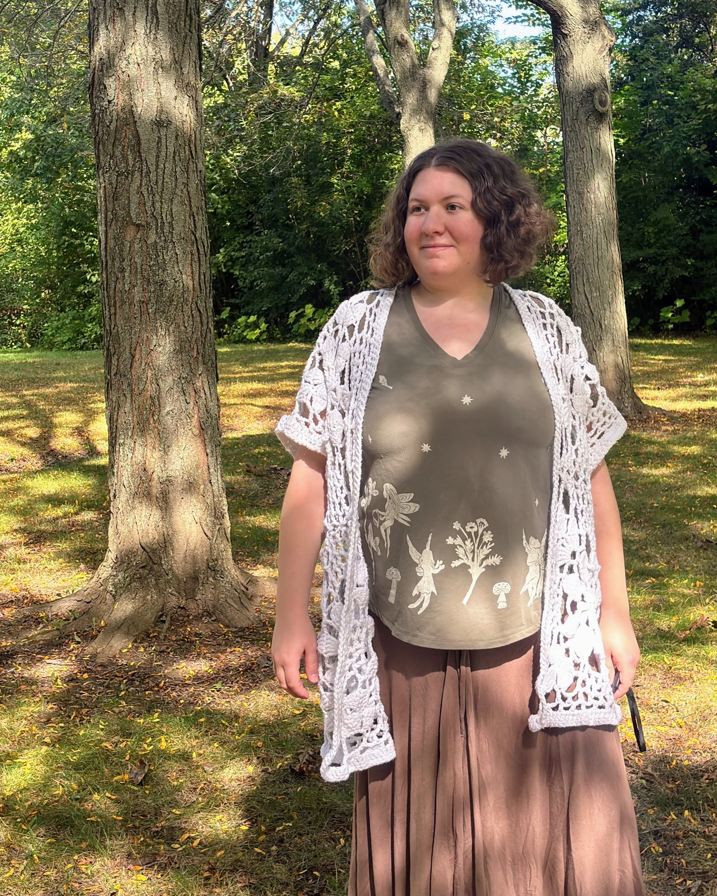 Fairy Garden Party; olive green short sleeve t-shirt featuring fairies and wildflowers