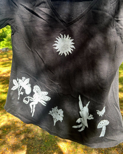 Frolicking Fairies; black t-shirt featuring fairies and wildflowers