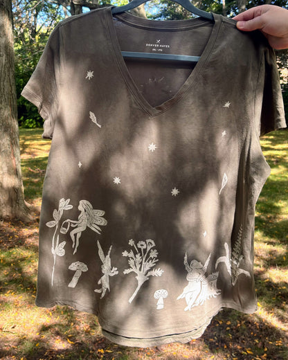 Fairy Garden Party; olive green short sleeve t-shirt featuring fairies and wildflowers